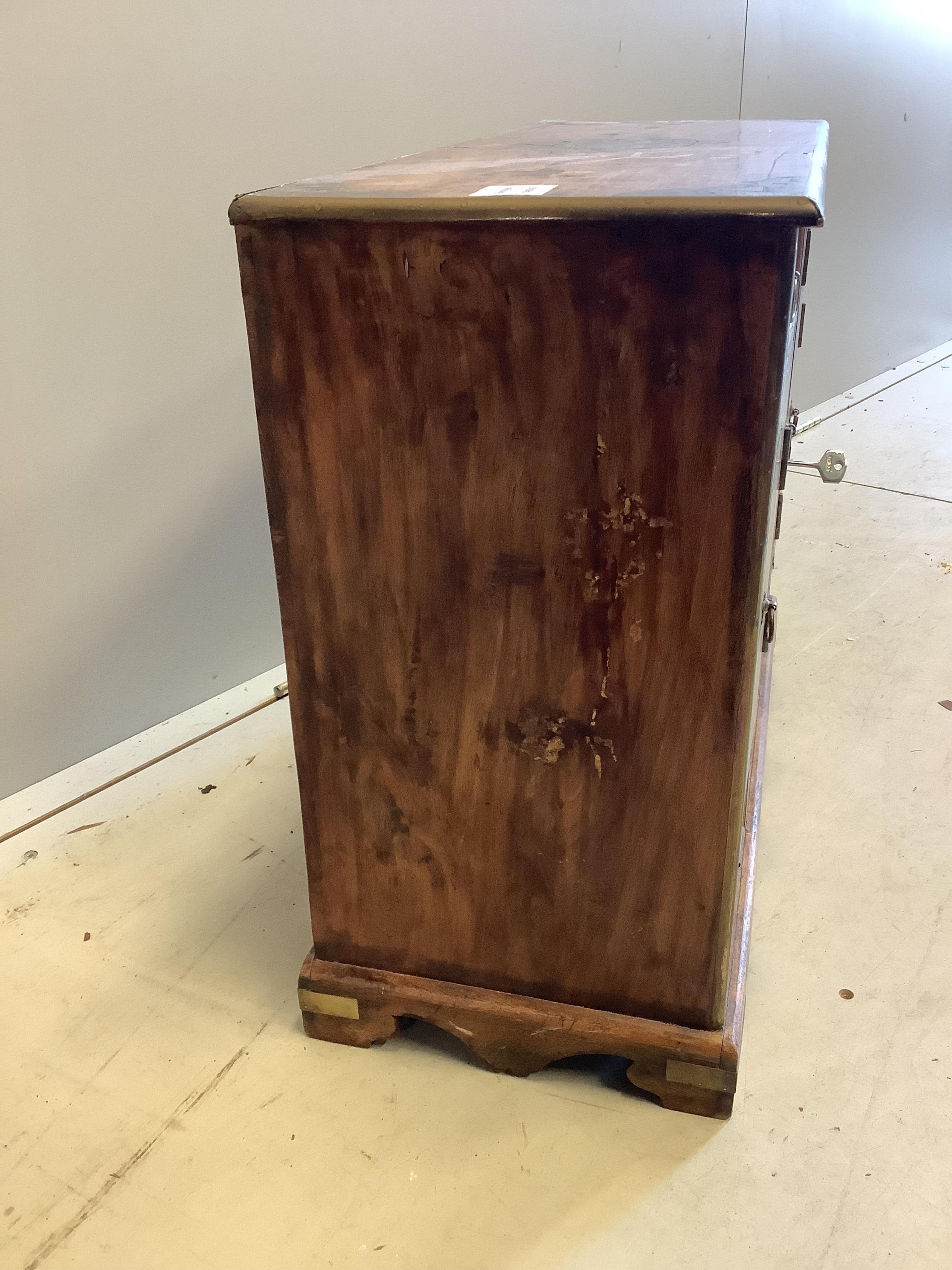 An unusual small Continental brass inlaid cabinet, fitted with three cupboards and five drawers, width 62cm, depth 25cm, height 50cm. Condition - fair